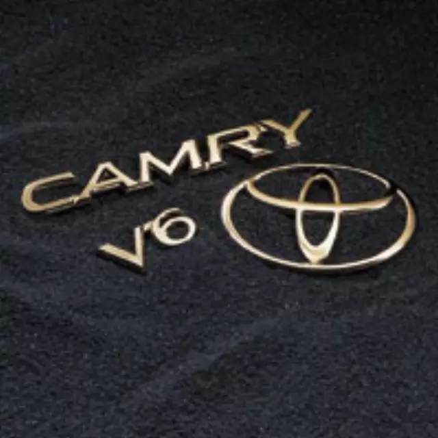 PT57703012 - Exterior: Gold Emblems, Gold Emb Camry Xle 4cyl (5pcs) for Toyota: Camry Image