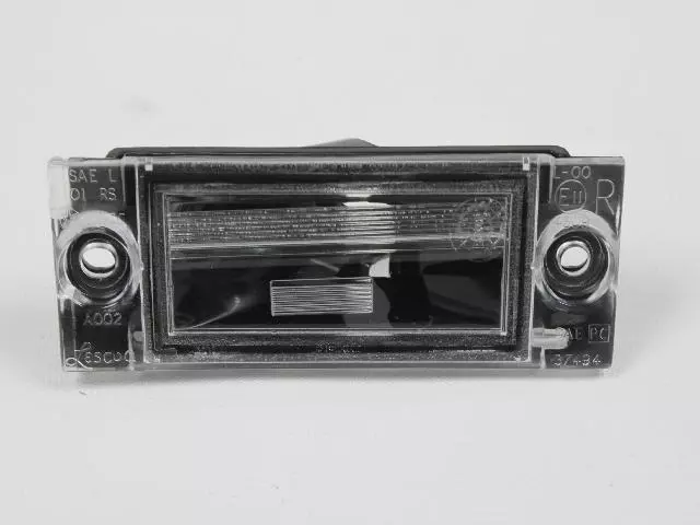 4857322AC - : License Plate Lamp, Left for Chrysler: Town &amp; Country, Voyager | Dodge: Caravan, Durango, Grand Caravan Image