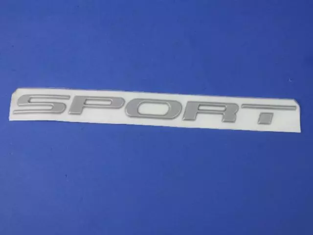 4805180AA - Body: Nameplate for Chrysler: Grand Voyager, Voyager | Dodge: Caravan, Grand Caravan Image