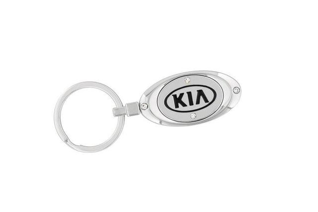UM016AY738 - Merchandise: Key Chain - Oval Kia W/Crystals Style 2 for Kia: Amanti, Borrego, Cadenza, Carnival, Forte, Forte Koup, Forte5, K5, K900, Niro, Niro EV, Optima, Rio, Rio5, Rondo, Sedona, Seltos, Sorento, Soul, Soul EV, Spectra, Spectra5, Sportage, Stinger, Telluride Image
