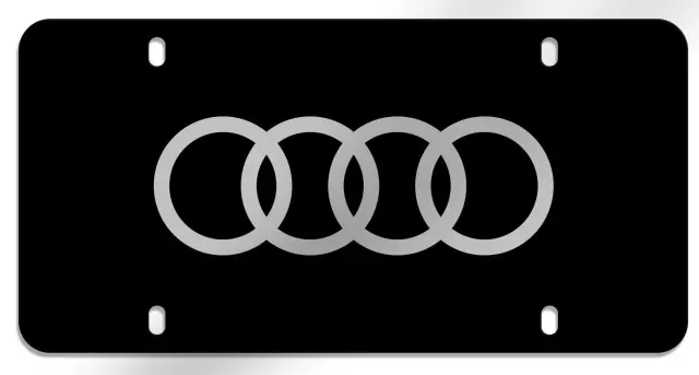 ZAW072850A - Exterior: Polycarbonate Audi Rings Vanity Plate - Black for Audi Image