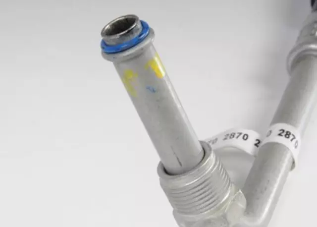 15112870 - : Engine Oil Cooler Inlet Hose Kit with Nut, Seal, Protector, and Cap for Cadillac: Escalade | Chevrolet: C1500, C2500, C3500, K1500 Pickup, K2500 Pickup, K3500 Pickup, Suburban K1500, Suburban K2500, Tahoe | GMC: C1500 Pickup, C2500 Pickup, C3500 Pickup, K1500 Pickup, K2500 Pickup, K3500 Pickup, Suburban K1500, Suburban K2500, Yukon Image