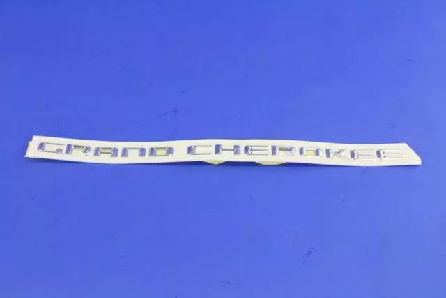 68236146AA - Exterior Ornamentation: Front Door Nameplate for Jeep: Grand Cherokee Image