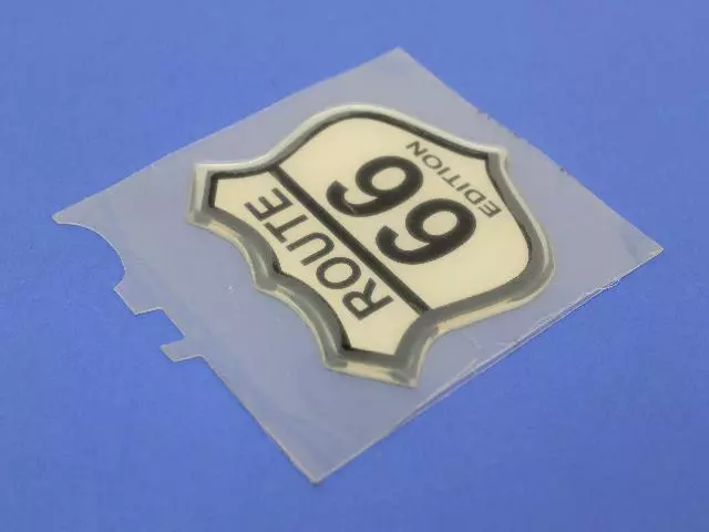 5152105AA - Exterior Ornamentation: Route 66 Edition Nameplate for Mopar Image