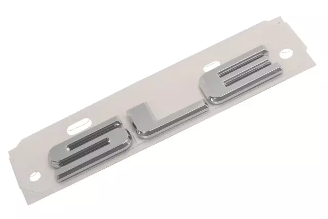 23256180 - Accessories: Tailgate Emblem for Chevrolet: Silverado 1500, Silverado 1500 LD, Silverado 2500 HD, Silverado 3500 HD | GMC: Acadia, Canyon, Sierra 1500, Sierra 1500 Limited, Sierra 2500 HD, Sierra 3500 HD, Yukon, Yukon XL Image