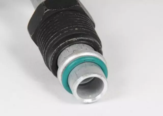 12472286 - : Engine Oil Cooler Outlet Hose Kit with Nut, Seal, and Protector for Chevrolet: K1500 Pickup, K2500 Pickup, K3500 Pickup, Suburban K1500, Suburban K2500 | GMC: K1500 Pickup, K2500 Pickup, K3500 Pickup, Suburban K1500, Suburban K2500 Image