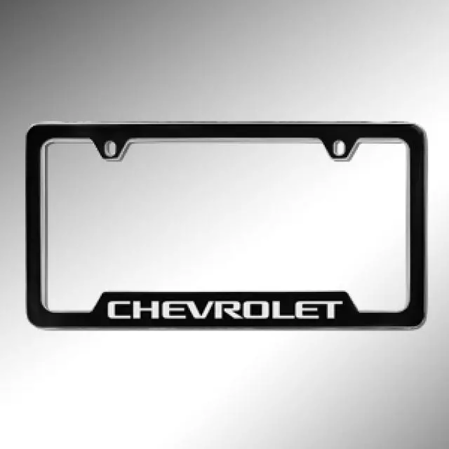 19330391 - : License Plate Frame, Chevrolet, Black for Cadillac: Escalade ESV | Chevrolet: Blazer, Blazer EV, Camaro, Colorado, Corvette, Cruze, Cruze Limited, Equinox, Equinox EV, Express 1500, Express 2500, Express 3500, Express 4500, Impala, Malibu, Silverado 1500, Silverado 1500 LD, Silverado 1500 LTD, Silverado 2500 HD, Silverado 3500 HD, Silverado EV, Sonic, Spark, Spark EV, SS, Suburban, Suburban 1500, Suburban 3500 HD, Tahoe, Trailblazer, Traverse, Trax, Volt Image