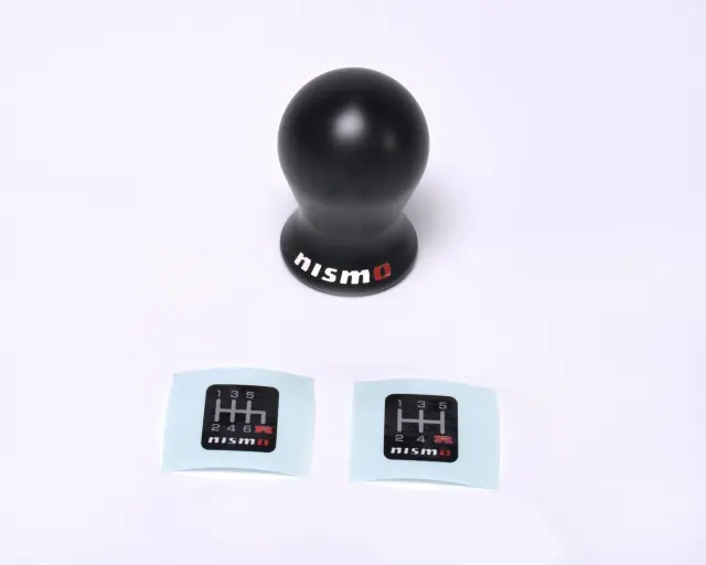 C28651EA05US - : Nismo Black Nylon Shift Knob for Nissan: 200SX, 240SX, 280ZX, 300ZX, 310, 350Z, 720, Altima, Armada, Axxess, Cube, Frontier, GT-R, Juke, Kicks, Maxima, Murano, NV1500, NV200, NV2500, NV3500, Pathfinder, Pathfinder Armada, Pulsar NX, Quest, Rogue, Rogue Select, Sentra, Stanza, TITAN, TITAN XD, Van, Versa, Versa Note, Xterra Image