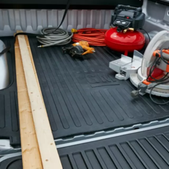 17803371 - Body: Bed Mat - Black with GM Logo - Standard Box for Chevrolet: Silverado 1500, Silverado 1500 LD, Silverado 2500 HD, Silverado 3500 HD | GMC: Sierra 1500, Sierra 1500 Limited, Sierra 2500 HD, Sierra 3500 HD Image