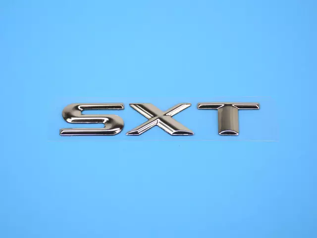 5113301AA - Exterior Ornamentation: Nameplate for Chrysler: Town &amp; Country | Dodge: Caravan, Grand Caravan Image