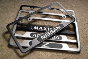 999MBSP005SA - Exterior: License Plate Frame (With Logo) - Satin for Nissan Image