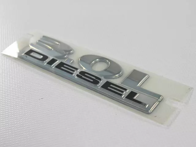 68038123AA - Exterior Ornamentation: Nameplate for Mopar Image