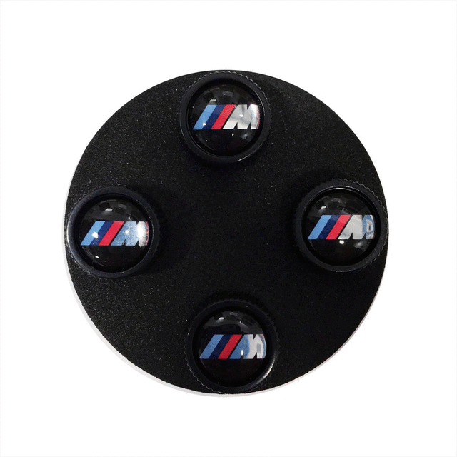 36122456427 - Wheels: Bmw M Valve Stem Caps - Black for BMW: 230i, 230i xDrive, 320i, 320i xDrive, 328d, 328d xDrive, 330e, 330i, 330i GT xDrive, 330i xDrive, 340i, 340i GT xDrive, 340i xDrive, 430i, 430i Gran Coupe, 430i xDrive, 440i, 440i xDrive, 530i, 530i xDrive, 540d xDrive, 540i, 540i xDrive, 640i, 640i Gran Coupe, 640i xDrive, 640i xDrive Gran Coupe, 640i xDrive Gran Turismo, 650i, 650i Gran Coupe, 650i xDrive, 650i xDrive Gran Coupe, 740i, 740i xDrive, 750i, 750i xDrive, 840i, 840i Gran Coupe, Alpina B6 xDrive Gran Coupe, Alpina B7, M2, M240i, M240i xDrive, M3, M340i, M4, M440i Gran Coupe, M5, M550i xDrive, M6, M6 Gran Coupe, M760i xDrive, M8, X1, X2, X3, X4, X5, X6, X7, Z4 Image