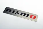 99993RN209 - : Nismo Badge for Nissan: 200SX, 240SX, 280ZX, 300ZX, 310, 350Z, 720, Altima, Armada, Axxess, Cube, Frontier, GT-R, Juke, Kicks, Maxima, Murano, NV1500, NV200, NV2500, NV3500, Pathfinder, Pathfinder Armada, Pulsar NX, Quest, Rogue, Rogue Select, Sentra, Stanza, TITAN, TITAN XD, Van, Versa, Versa Note, Xterra Image